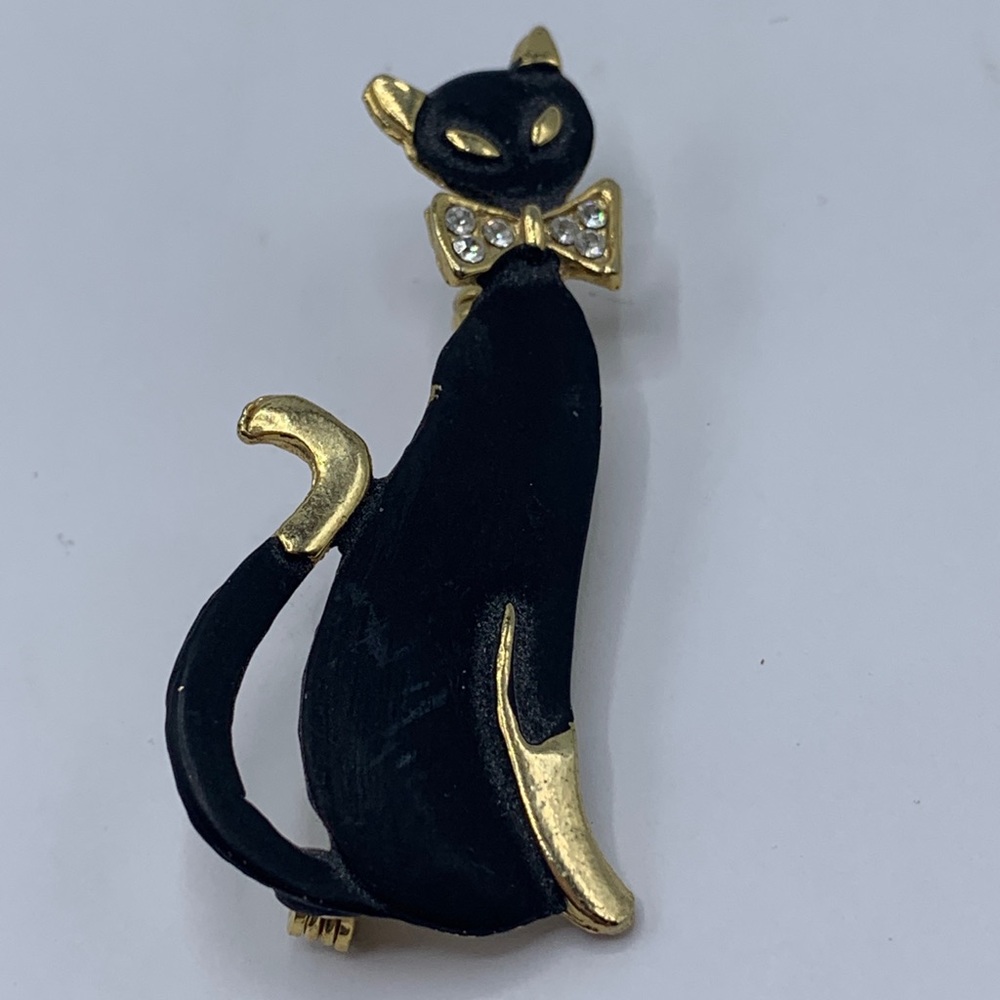 Vintage black Siamese cat pin with rhinestones 2 inches high.